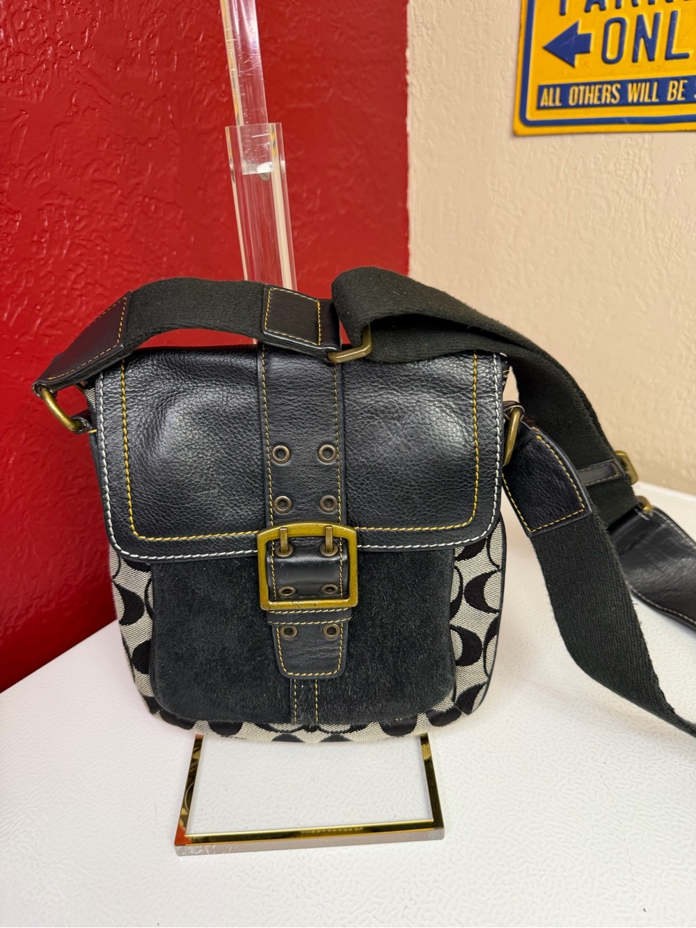 Coach Black with Brass Buckle. Leather, suede and cloth.